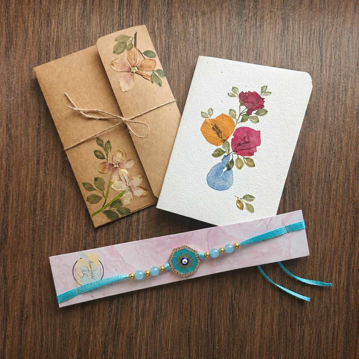Handmade pressed flower Raksha Bandhan greeting card with rakhi thread