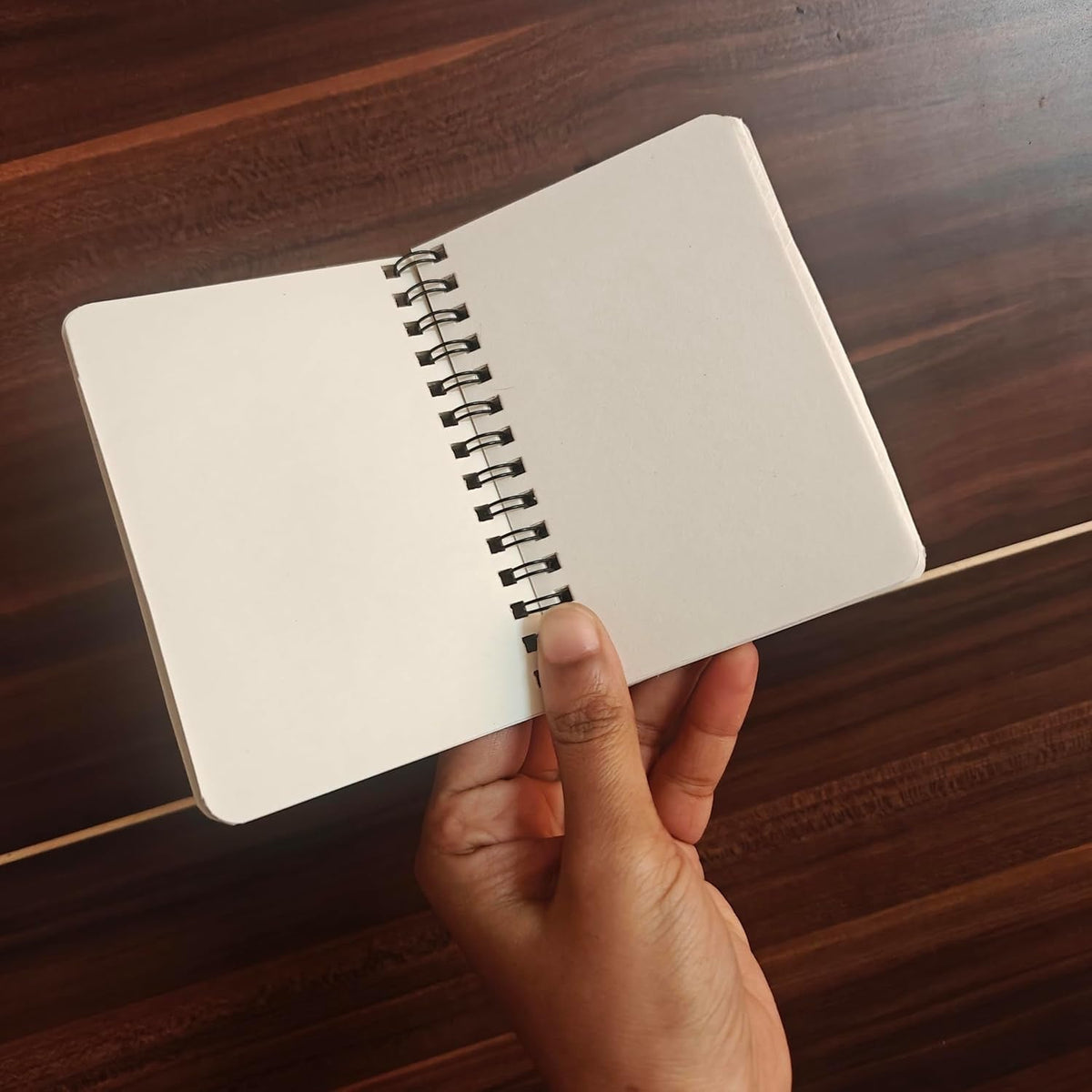 Pressed flower journal open to blank pages