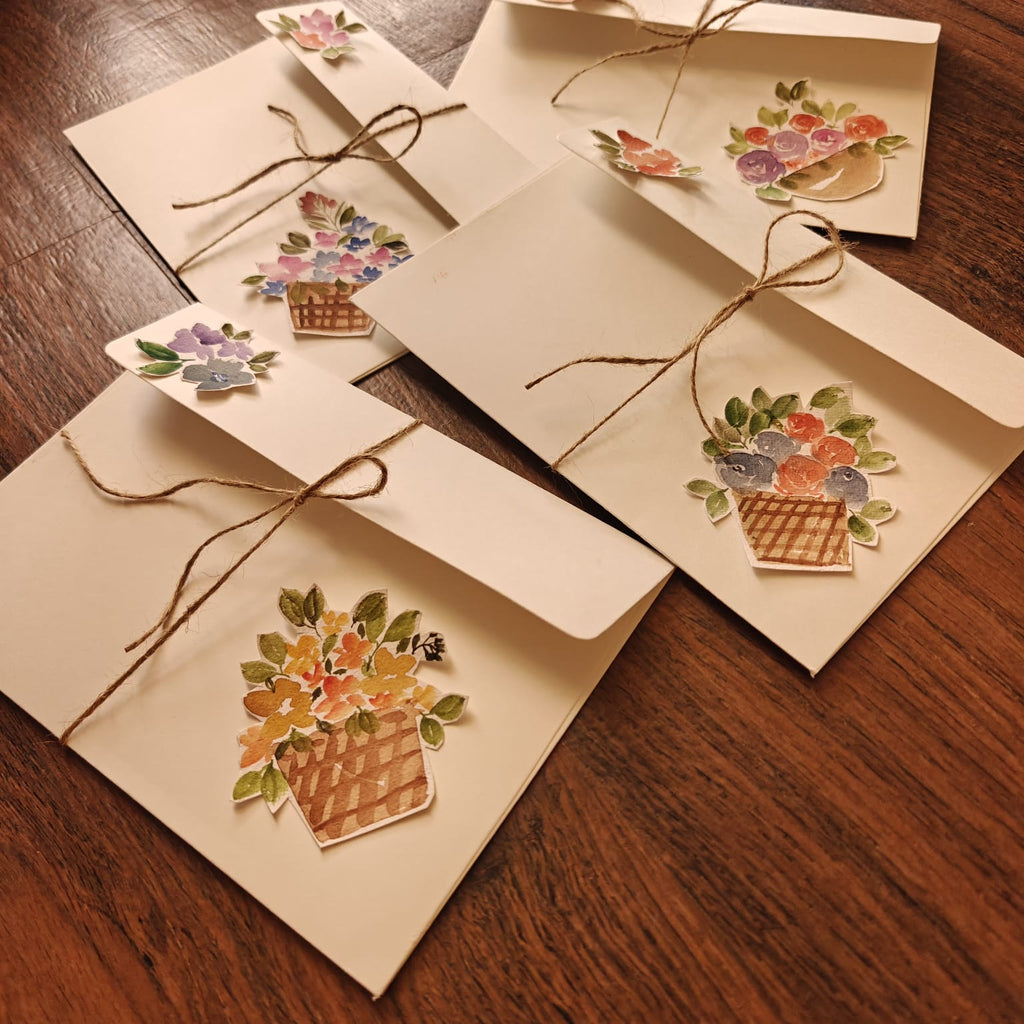 A5 white envelope with orange floral basket sticker and jute twine bow